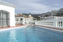 Click here to see a larger photo of the pool of Villa Alamar looking up, from Burriana Beach Nerja, to the mountains